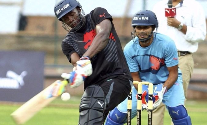 Bolt at the crease for PUMA's 'Bolt and Yuvi - Battle of the Legends' exhibition match in 2014.