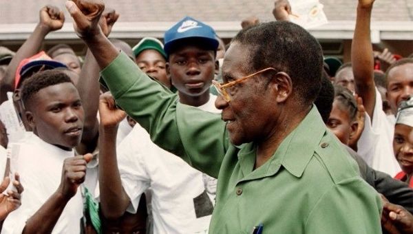 In 2000, Robert Mugabe greeted supporters after vowing to reclaim land from white farmers.