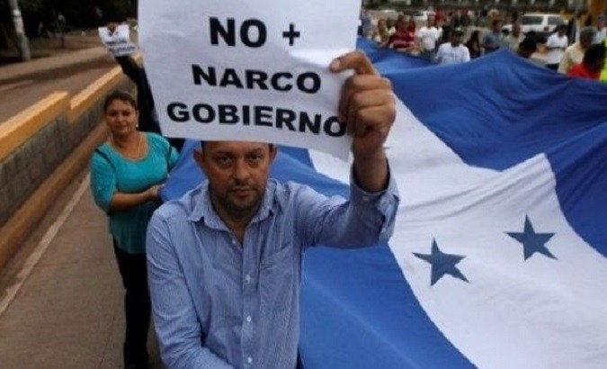Supporters of Honduras' Opposition Alliance march against President Juan Orlando Hernandez.