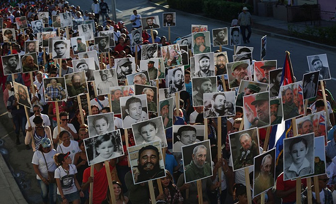 Cubans march toward Fidel's resting place in Santiago de Cuba.
