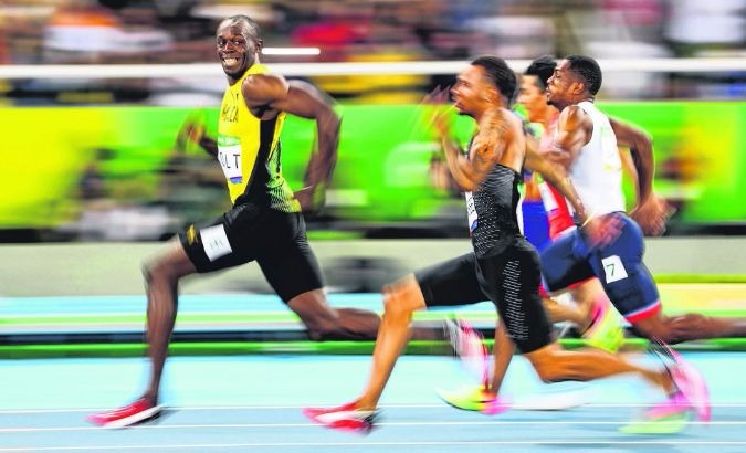 Usain Bolt en route to taking first place.