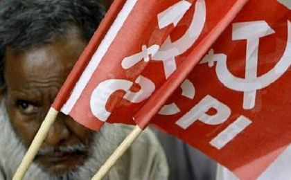 A member of the Communist Party of India hoists a banner in New Delhi.