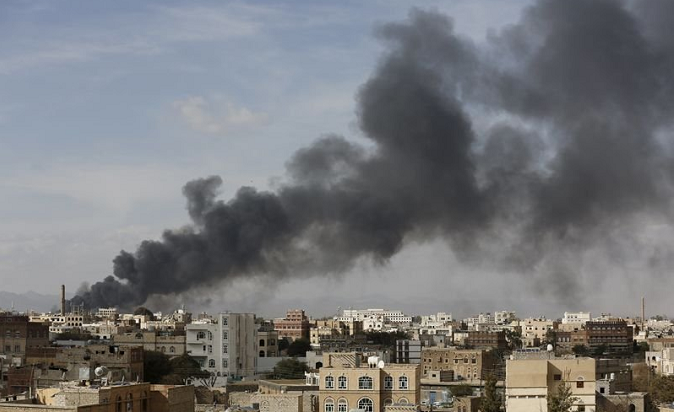 Smoke billows from a site hit by Saudi-led air strikes in Yemen's capital Sanaa