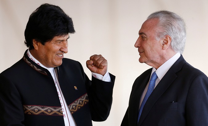 Bolivia's President Evo Morales greets Brazil's President Michel Temer before a working session at Mercosur trade bloc annual summit in Brasilia, Brazil December 21, 2017