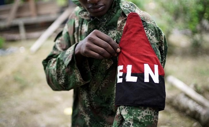 A rebel of Colombia's Marxist National Liberation Army (ELN) shows his armband while posing for a photograph, in the northwestern jungles, Colombia August 31, 2017.