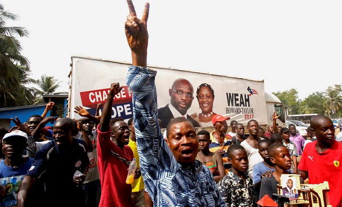 Supporters of George Weah celebrate after the announcement of the presidential election results in Monrovia, Liberia Dec. 28, 2017.