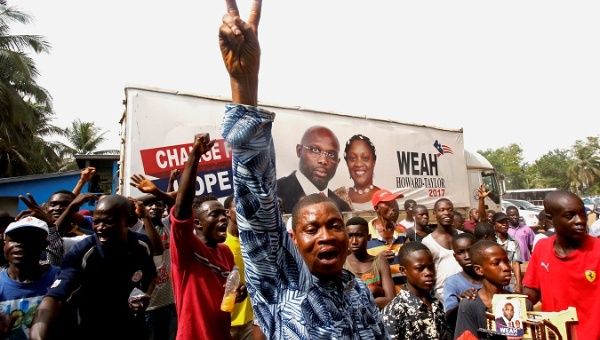 Supporters of George Weah celebrate after the announcement of the presidential election results in Monrovia, Liberia Dec. 28, 2017. 
