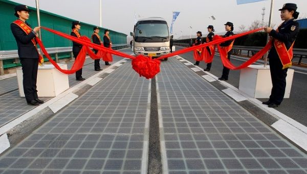 A vehicle is seen on a solar panel expressway during its opening in Jinan, Shandong province, China December 28, 2017.