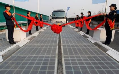 A vehicle is seen on a solar panel expressway during its opening in Jinan, Shandong province, China December 28, 2017.