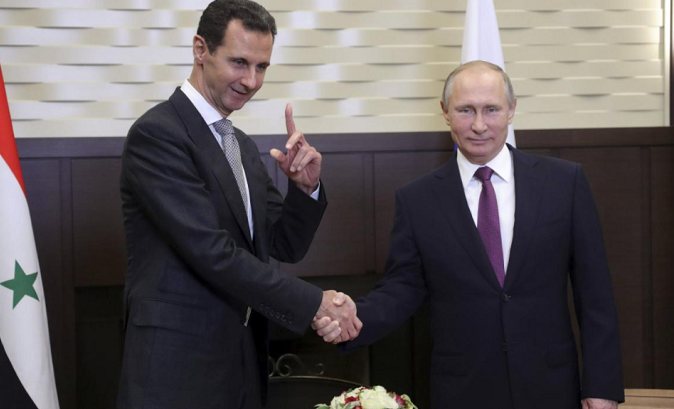 Syrian leader Bashar al Assad (left) meets Russian President Vladimir Putin (right).