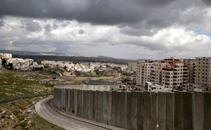 A general view picture shows the Israeli barrier running between the East Jerusalem refugee camp of Shuafat (R) and Pisgat Zeev, both located in an area Israel annexed to Jerusalem after capturing it in the 1967 Middle East war, Feb. 15, 2017