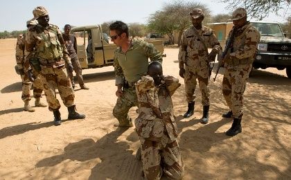 A U.S. special forces soldier demonstrates how to detain a suspect during Flintlock 2014, a US-led international training mission for African militaries.