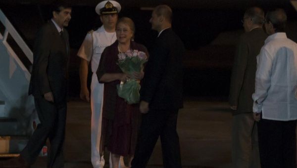 Chilean President Bachelet disembarks her plane.