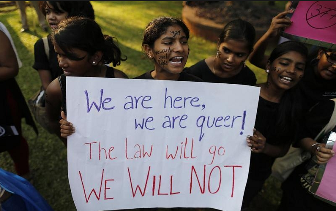 LGBT rights activists shout slogans during a protest in Mumbai December 15, 2013.