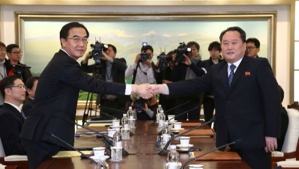 Head of the North Korean delegation, Ri Son Gwon shakes hands with his South Korean counterpart Cho Myoung-gyon during their meeting at the truce village, January 9, 2018. 