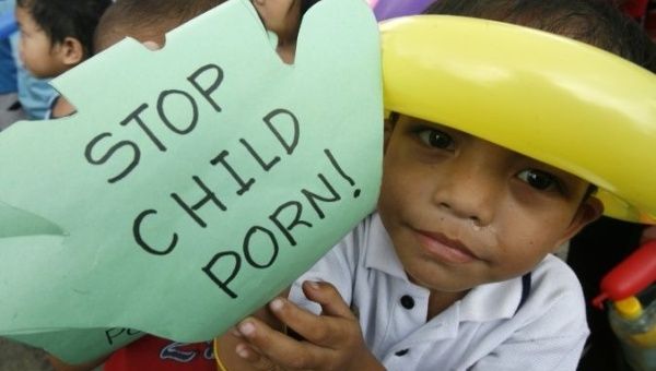 A child takes part in an anti-child pornography rally in Manila, Phillipines.