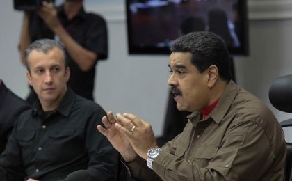 Venezuela's President Nicolas Maduro (R) speaks during a meeting with ministers in Caracas, Venezuela January 5, 2017
