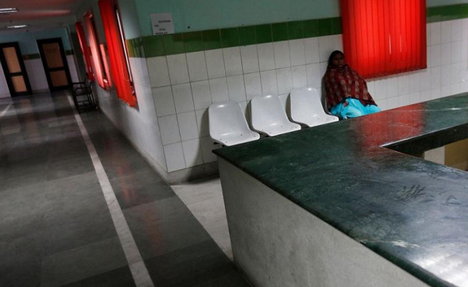 A patient sits outside a doctor's room inside Janakpuri Super Speciality Hospital in New Delhi January 19, 2015.