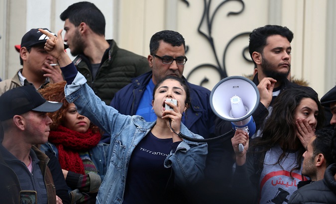 A demonstrators shout slogans during protests against rising prices and tax increases, in Tunis, Tunisia January 9, 2018