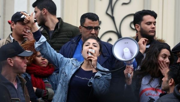 A demonstrators shout slogans during protests against rising prices and tax increases, in Tunis, Tunisia January 9, 2018