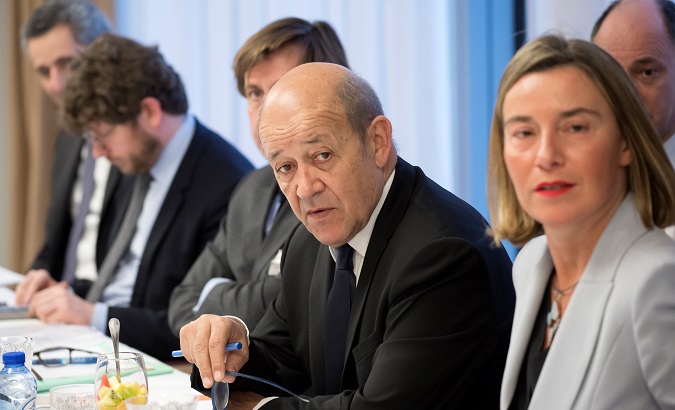 French Foreign Minister Le Drian (L) and EU's foreign policy chief Mogherini (R) at meeting with foreign ministers in Brussels.
