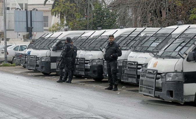 Riot policemen stand guard in Tebourba, Tunisia on January 11, 2018.