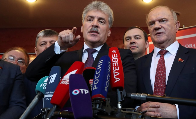 Pavel Grudinin, head of the Lenin State Farm and Communist Party presidential nominee talks to the media as he stands next to Russia's Communist Party leader Gennady Zyuganov after a party congress in Snegiri outside Moscow, Russia, December 23, 2017.