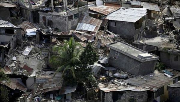 Destroyed buildings are seen after a major earthquake hit the capital Port-au-Prince January 13, 2010. Reuters