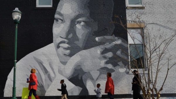 People gather to march in the annual parade down MLK Boulevard to honor Martin Luther King, in Chattanooga, Tennessee. REUTERS/Billy Weeks.