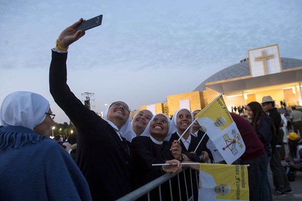 Nuns take a selfie at O'Higgins Park ahead of a scheduled mass in Santiago. 