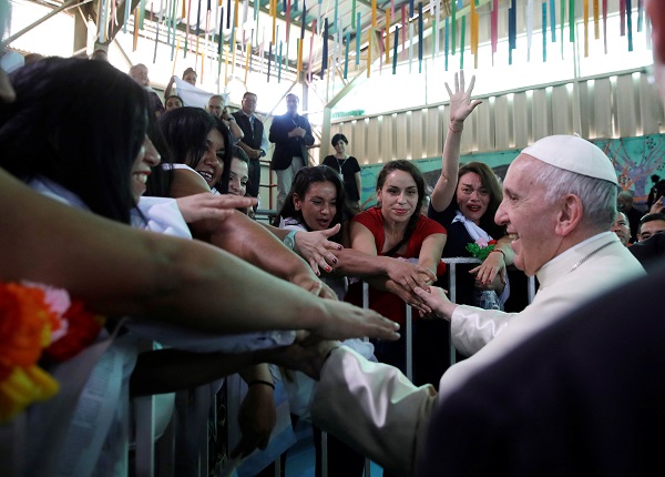 Pope Francis greets inmates at the San Joaquin women's prison in Santiago. 