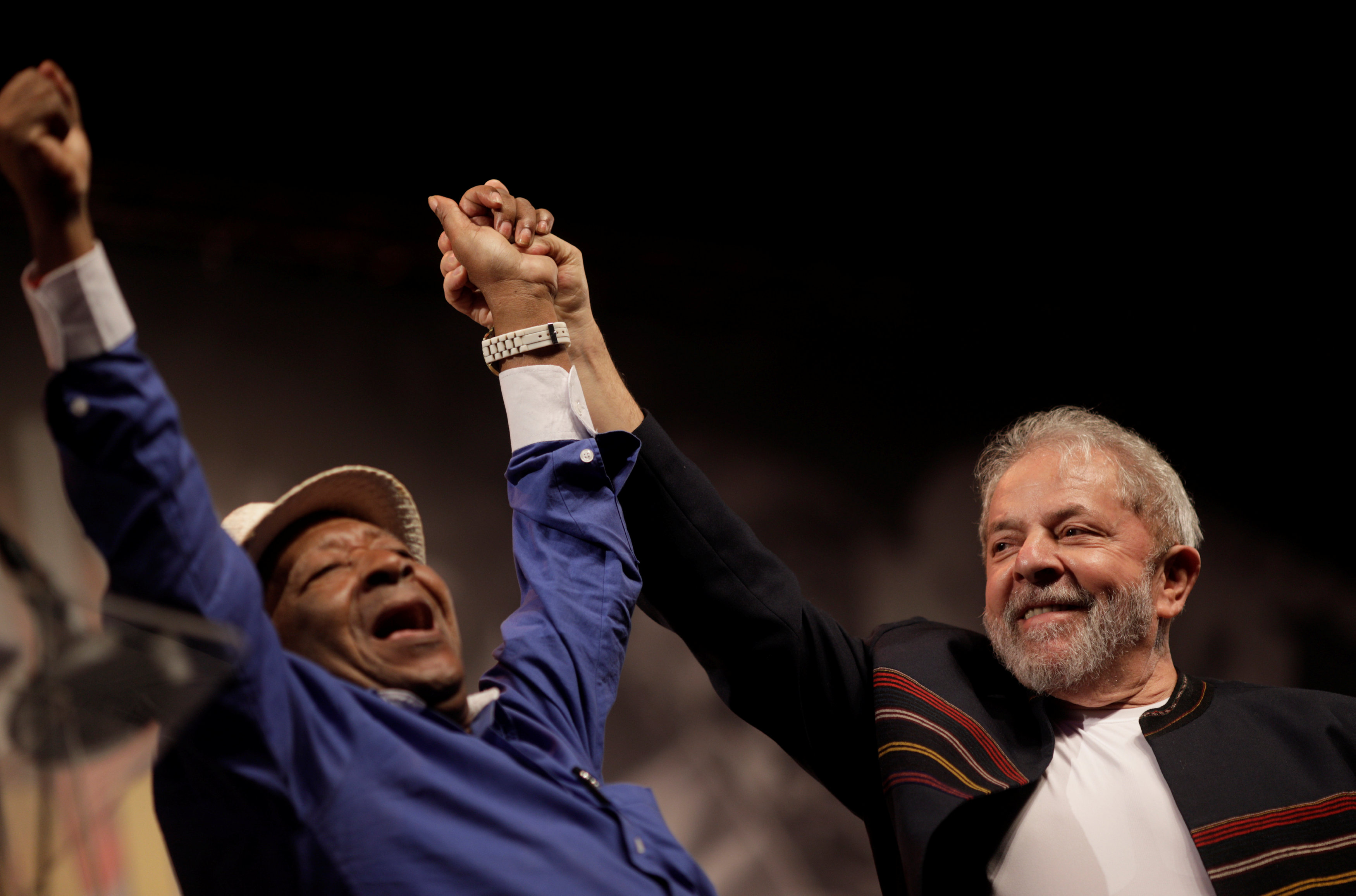 Brazil's Lula da Silva (R) with samba composer and singer Noca da Portela during an event in support of his presidential bid.