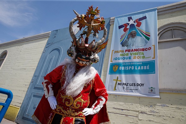 A dancer from the Diablada group poses for a picture. The dance is a key feature of the Fiesta de La Tirana, 84km from the city of Iquique. Tirana's population of less than 400 swells during the annual festivities, between 12 and 16 July, to nearly 120,000.