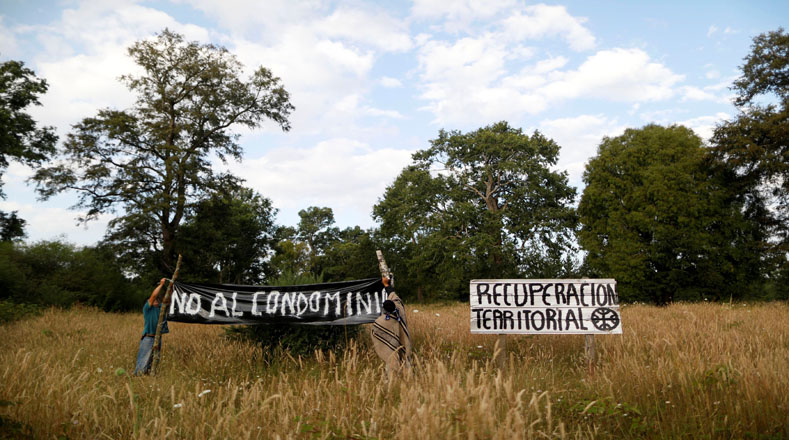 Indigenous community members reclaiming their ancestral lands.