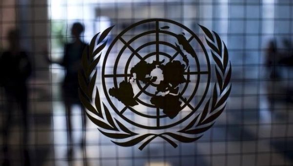 A United Nations logo is seen on a glass door in the Assembly Building at the United Nations headquarters in New York City.