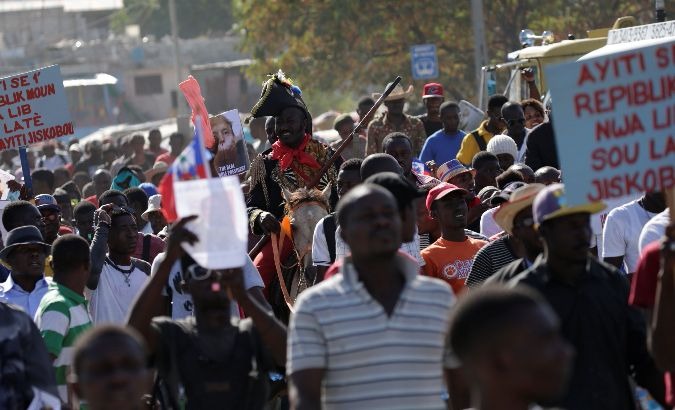 Protesters march against reported comments made by U.S. President Donald Trump about Haiti, in the streets of Port-au-Prince.