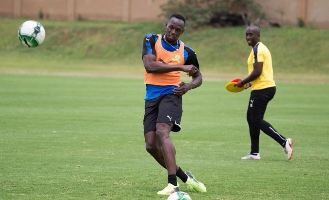 Bolt in a soccer training session in South Africa.