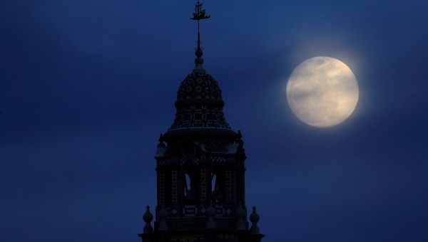 A blue moon rises over Balboa Park's California Tower in San Diego, California, in the United States, January 30.