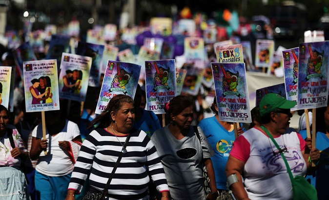 Women participate in a demonstration to commemorate the UN International Day for the Elimination of Violence against Women in San Salvador.