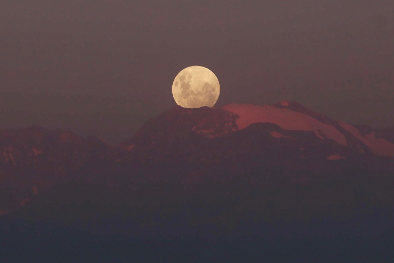 A full moon 'super moon' rises over Los Andes mountain range in Santiago, Chile.