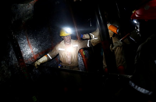 Miners work deep underground at Sibanye Gold's Masimthembe shaft in Westonaria, South Africa, in this file photo from 2017.
