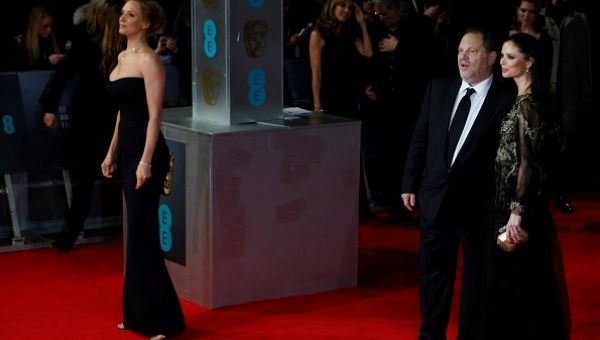 Uma Thurman (L), Harvey Weinstein and Georgina Chapman arrive at the BAFTA awards ceremony in London in 2014.