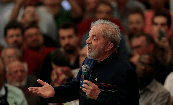 Lula gives a speech at a mass to mark one year since his wife's death.
