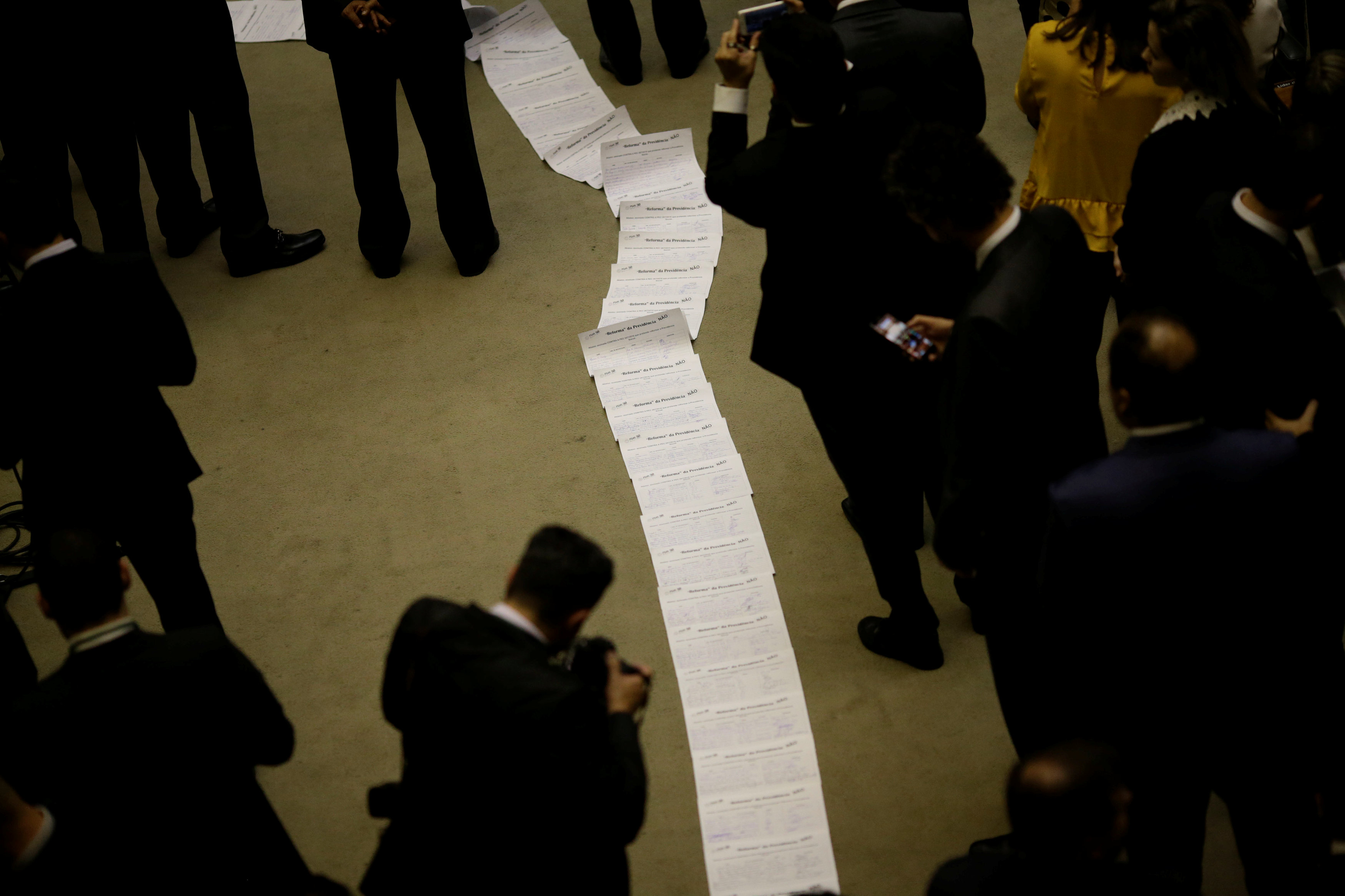 Federal deputies of opposition protest showing signatures against the pension reform during an opening session of the Year of the Legislative, in Brasilia, Brazil, February 5, 2018.