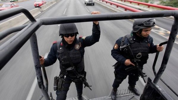 Members of the Fuerza Civil (Civil Force) police patrol during a media presentation in Monterrey, Mexico. Dec. 17, 2014. 