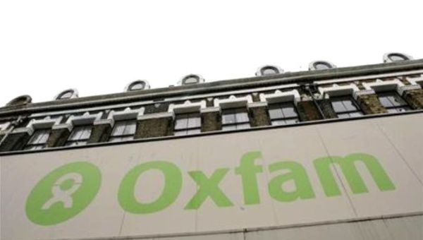  The Oxfam logo is seen on a signage outside a store in Dalston in east London.