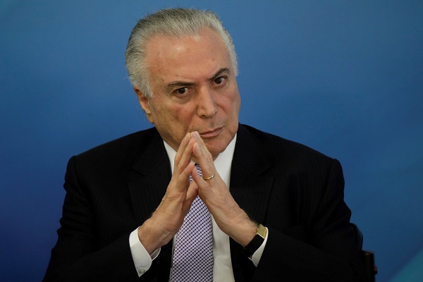Brazilian President Michel Temer has denied any role in the corruption scandals and answered questions put to him in writing by the police.