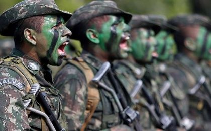 Brazilian Army soldiers react at the border with Colombia during a training to show efforts to step up security along borders, in Vila Bittencourt, Amazon State, Brazil.