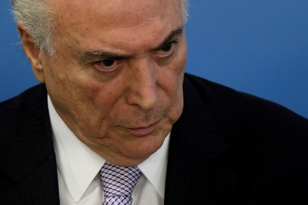 President Michel Temer has denied any role in the corruption scandal and answered police questions, even though he was not obliged to, his lawyer said.