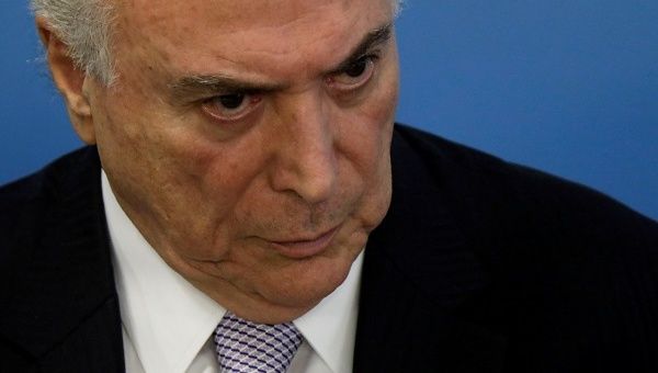 President Michel Temer has denied any role in the corruption scandal and answered police questions, even though he was not obliged to, his lawyer said.
